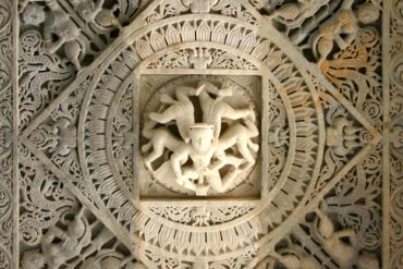 The depiction of akichaka, a bearded man with five bodies representing the five elements at Ranakpur Jain Temple