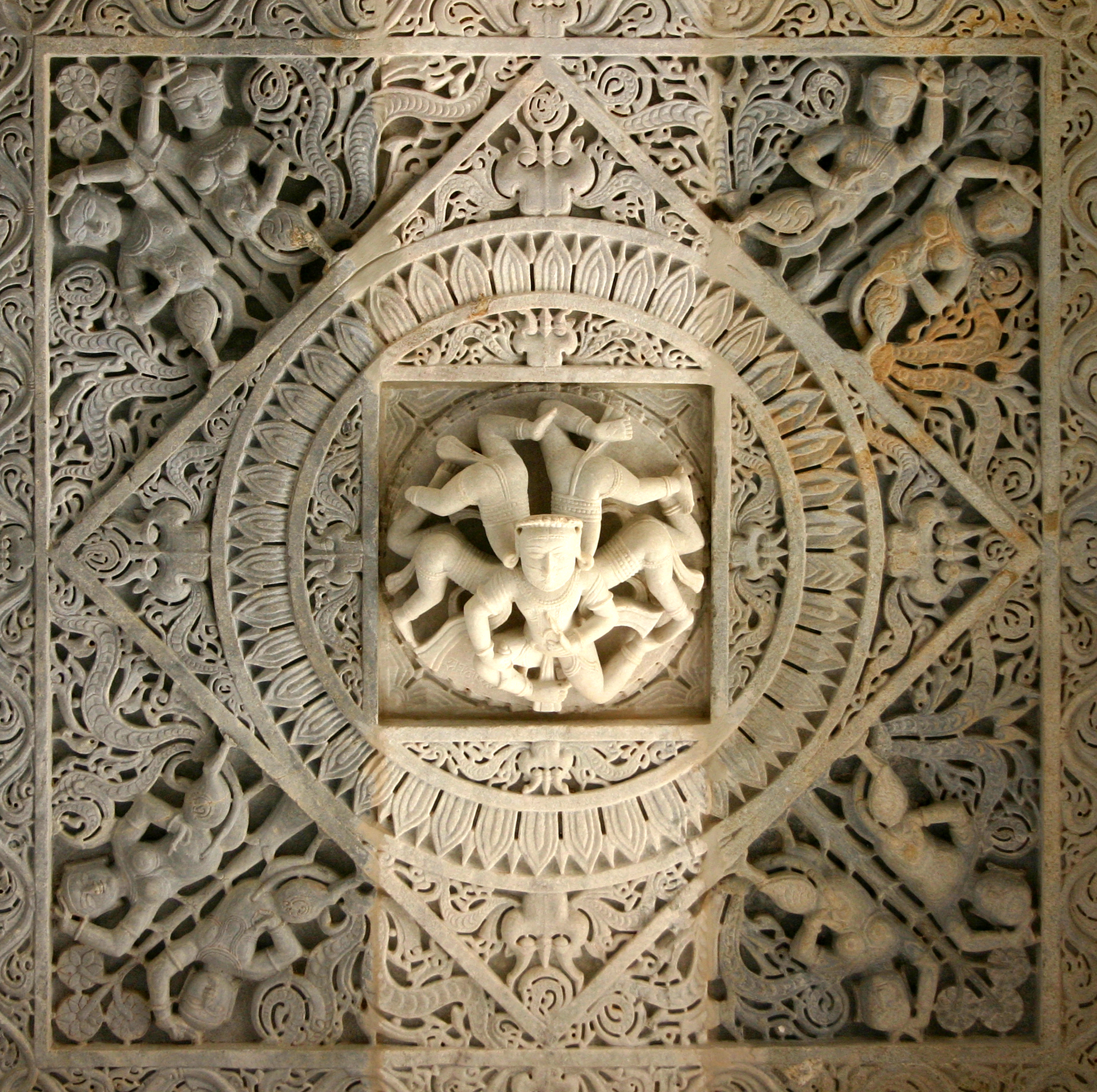 The depiction of akichaka, a bearded man with five bodies representing the five elements at Ranakpur Jain Temple
